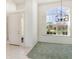 Entryway with grand window, allowing plenty of natural light to enter the home at 5556 Sabal Trace Dr, North Port, FL 34287