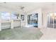 Bright living room with large windows overlooking the pool area and the water at 5556 Sabal Trace Dr, North Port, FL 34287