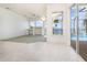 Open-concept living area with a view of the pool and waterfront through large windows at 5556 Sabal Trace Dr, North Port, FL 34287