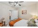 Cozy bedroom with a queen-size bed and access to the bathroom at 5808 Calla Lilly Dr, Sarasota, FL 34232