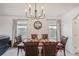 Formal dining room with dark wood table and chandelier at 5808 Calla Lilly Dr, Sarasota, FL 34232