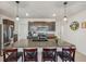Granite island kitchen with dark brown cabinets and stainless steel appliances at 5808 Calla Lilly Dr, Sarasota, FL 34232