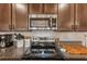Modern kitchen features with gas cooktop and stainless steel microwave at 5808 Calla Lilly Dr, Sarasota, FL 34232