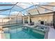 Inviting screened pool and spa perfect for relaxation at 5808 Calla Lilly Dr, Sarasota, FL 34232