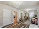 Elegant sitting room with chandelier and ornate furniture at 5808 Calla Lilly Dr, Sarasota, FL 34232