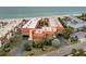 Aerial view of beachfront property with pool and parking at 6006 Gulf Dr # 207, Holmes Beach, FL 34217