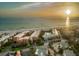 Beachfront property at sunset, aerial view at 6006 Gulf Dr # 207, Holmes Beach, FL 34217