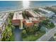 Aerial view of beachfront condo complex with pool and ocean views at 6006 Gulf Dr # 207, Holmes Beach, FL 34217