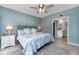 King-size bed, ensuite bathroom access, and coastal decor at 6006 Gulf Dr # 207, Holmes Beach, FL 34217
