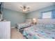 Two beds, TV, ceiling fan, and coastal decor at 6006 Gulf Dr # 207, Holmes Beach, FL 34217