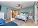 Beach-themed bedroom with king-size bed, access to balcony, and ensuite bathroom at 6006 Gulf Dr # 207, Holmes Beach, FL 34217
