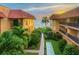 Ground level view of courtyard with shuffleboard and ocean access at 6006 Gulf Dr # 207, Holmes Beach, FL 34217