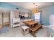 Charming dining room with a rustic wooden table and bench seating at 6006 Gulf Dr # 207, Holmes Beach, FL 34217