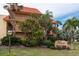 Condo building exterior showcasing landscaping and signage at 6006 Gulf Dr # 207, Holmes Beach, FL 34217