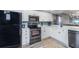 Updated kitchen, featuring stainless steel appliances and white cabinets at 6006 Gulf Dr # 207, Holmes Beach, FL 34217