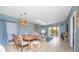 Bright living room featuring a comfortable sectional sofa and dining area at 6006 Gulf Dr # 207, Holmes Beach, FL 34217