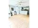 Open living room with tile floors and neutral walls, flowing into a well-lit kitchen with white cabinetry at 10024 Strafford Oak Ct # 815, Tampa, FL 33624