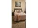 Cozy bedroom with a queen bed, plush bedding and wall art at 10079 Deer St, Spring Hill, FL 34608