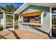 Custom poolside bar with pass-through window at 11134 115Th St, Largo, FL 33778