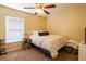 Bright bedroom with a double bed and window coverings at 11412 Coconut Island Dr, Riverview, FL 33569