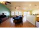 Spacious living area with hardwood floors and a view into kitchen at 11412 Coconut Island Dr, Riverview, FL 33569