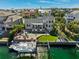 Stunning waterfront home with a private dock, pool, and lush landscaping at 123 8Th E St, Tierra Verde, FL 33715