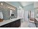 Modern bathroom features a stylish vanity, unique tile work, and natural light at 123 8Th E St, Tierra Verde, FL 33715