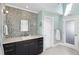 This light bathroom features mosaic tile, a sleek vanity, and lots of natural light at 123 8Th E St, Tierra Verde, FL 33715