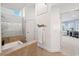 Bathroom featuring separate shower and tub, with view of the bedroom through an open doorway at 123 8Th E St, Tierra Verde, FL 33715