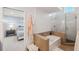 Bathroom with tiled shower and separate bathtub with a view of the bedroom at 123 8Th E St, Tierra Verde, FL 33715