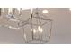 A close up of the modern chandelier fixture in the kitchen at 123 8Th E St, Tierra Verde, FL 33715