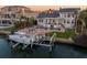 Back of the house showing pool, dock, boat lift, and waterfront view at 123 8Th E St, Tierra Verde, FL 33715