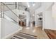 Open concept foyer with modern staircase, skylights, and beautiful tile flooring at 123 8Th E St, Tierra Verde, FL 33715