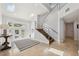 Grand foyer with high ceilings, modern staircase, and plenty of natural light at 123 8Th E St, Tierra Verde, FL 33715