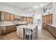 Bright kitchen featuring wood cabinets, stainless appliances, a large island with seating, and water views at 123 8Th E St, Tierra Verde, FL 33715