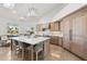 Bright kitchen featuring wood cabinets, stainless appliances, a large island with seating, and water views at 123 8Th E St, Tierra Verde, FL 33715