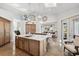 Spacious kitchen with a large island, skylights, and wood cabinets, perfect for cooking and entertaining at 123 8Th E St, Tierra Verde, FL 33715