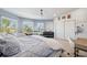 Charming main bedroom featuring a bay window, workstation, and ample closet space at 123 8Th E St, Tierra Verde, FL 33715