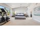 The main bedroom features large windows, ensuite access, and neutral color palette at 123 8Th E St, Tierra Verde, FL 33715