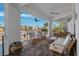 Outdoor patio with comfortable seating overlooking the water at 123 8Th E St, Tierra Verde, FL 33715
