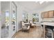 Cozy seating area with neutral decor, natural light, and access to the outdoors, perfect for relaxing at 123 8Th E St, Tierra Verde, FL 33715