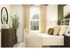 Bedroom with white metal bed frame and dark wood dresser at 12442 Sweet Angel Aura Way, Parrish, FL 34219