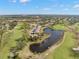Aerial view of a community with golf course and pond at 1328 Pelican Creek Xing # D, St Petersburg, FL 33707