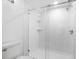 Modern bathroom featuring a walk-in shower with textured walls at 1328 Pelican Creek Xing # D, St Petersburg, FL 33707