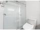 Bathroom with a frameless glass shower door and modern toilet at 1328 Pelican Creek Xing # D, St Petersburg, FL 33707