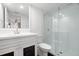 Updated bathroom with a white vanity and walk-in shower at 1328 Pelican Creek Xing # D, St Petersburg, FL 33707