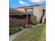 Charming two-story condo with a covered parking area, fenced patio, and lush landscaping at 1328 Pelican Creek Xing # D, St Petersburg, FL 33707