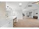 Modern kitchen with white cabinets, gold accents, and quartz countertops at 1328 Pelican Creek Xing # D, St Petersburg, FL 33707