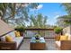 Relaxing outdoor patio with comfortable seating and a stunning view of the lake at 1328 Pelican Creek Xing # D, St Petersburg, FL 33707
