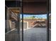 Private patio with gray tile flooring and potted plants at 1328 Pelican Creek Xing # D, St Petersburg, FL 33707